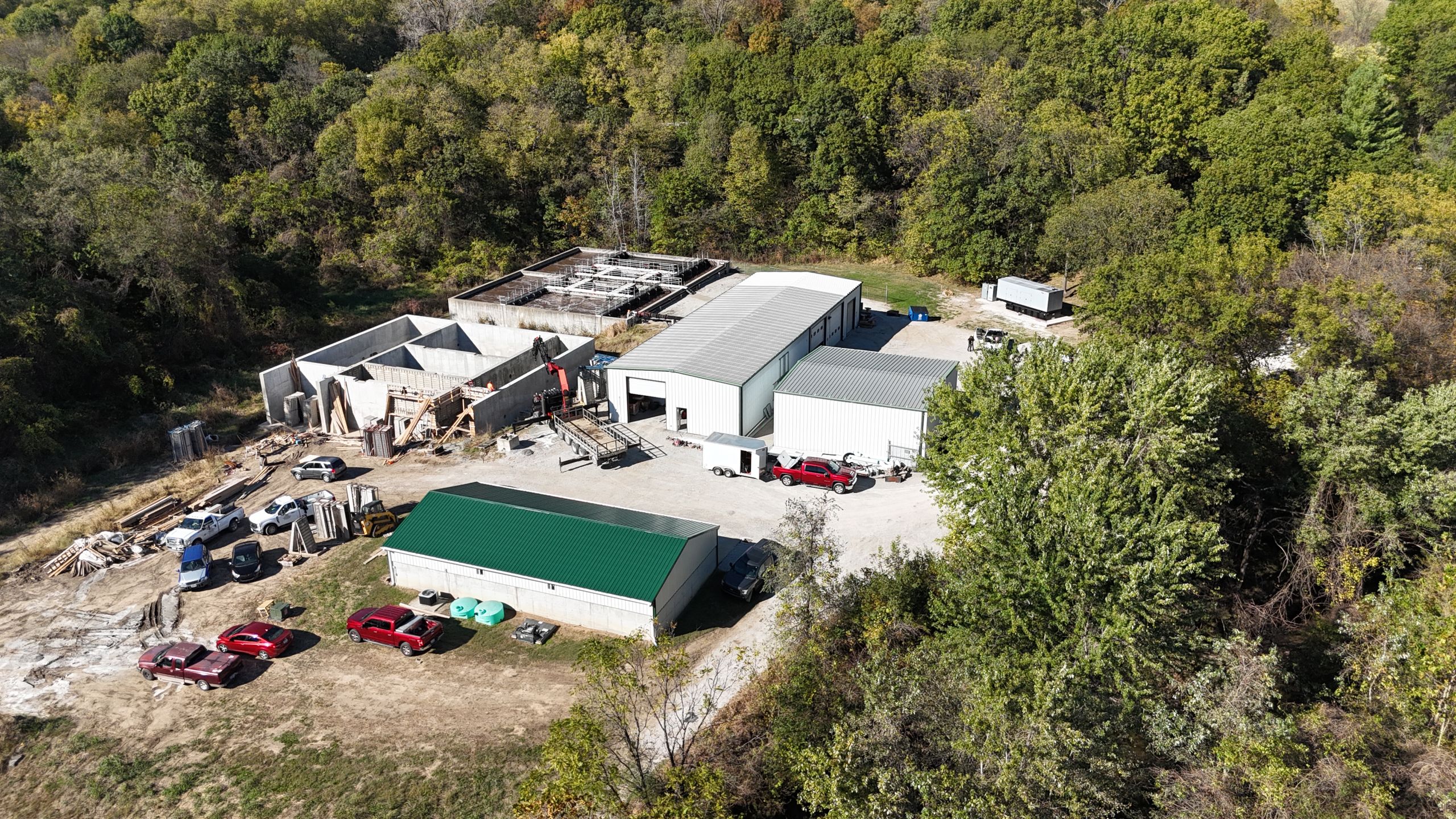 Aerial view of the Timber Creek Wastewater Treatment plant expansion showing metal operations buildings, new concrete basins, and site staging by Havens.
