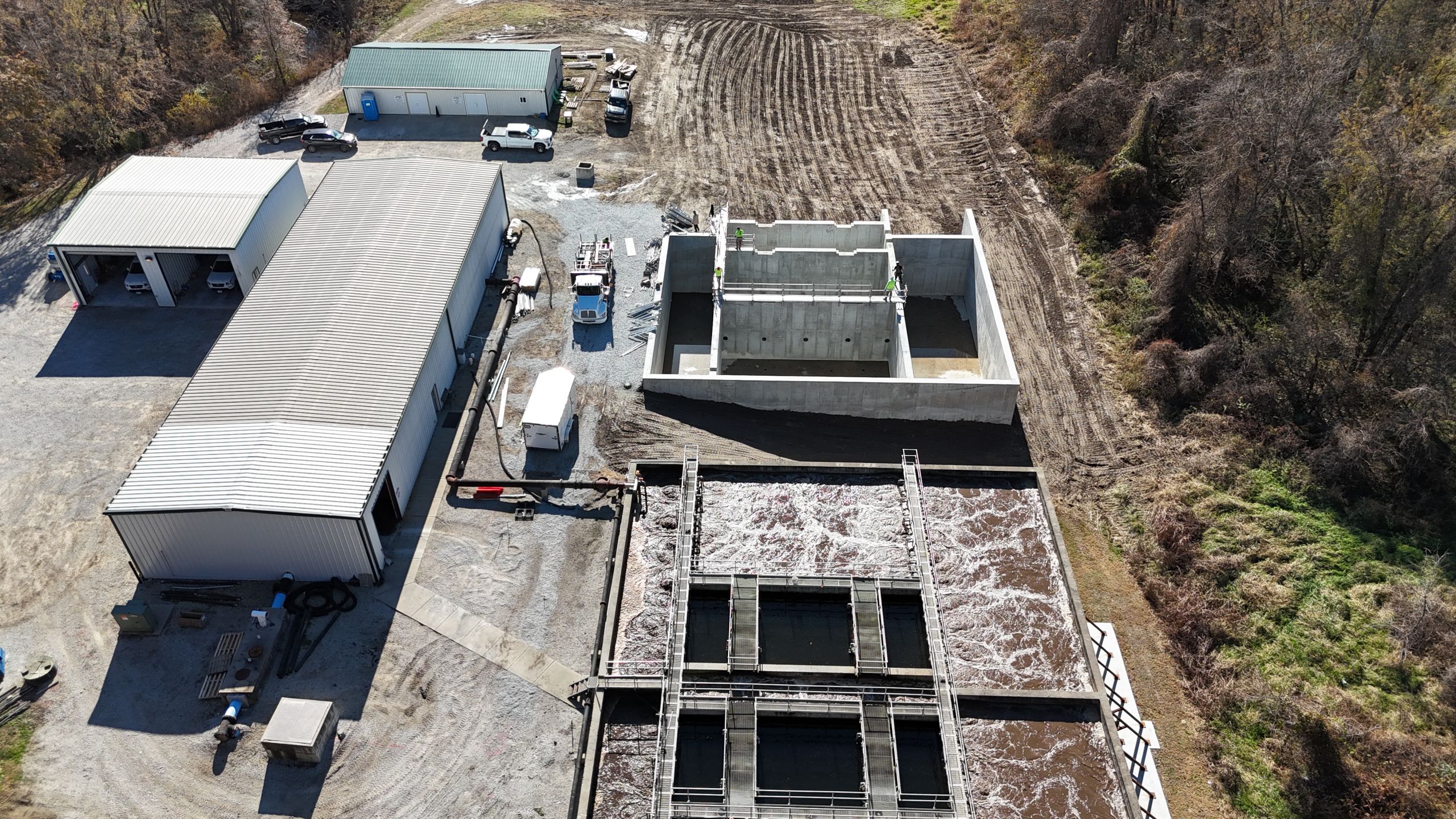 High-angle shot of industrial wastewater infrastructure and concrete tank construction at the Havens Timber Creek project site.